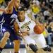 Michigan freshman Trey Burke dribbles the ball around Northwestern juniot Reggie Hearn in the first half against Northwestern at Crisler Center on Wedensday. Melanie Maxwell I AnnArbor.com
